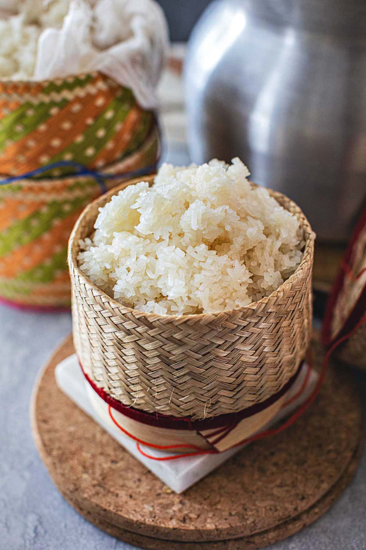  Thai sticky rice in a bamboo basket on the table. 