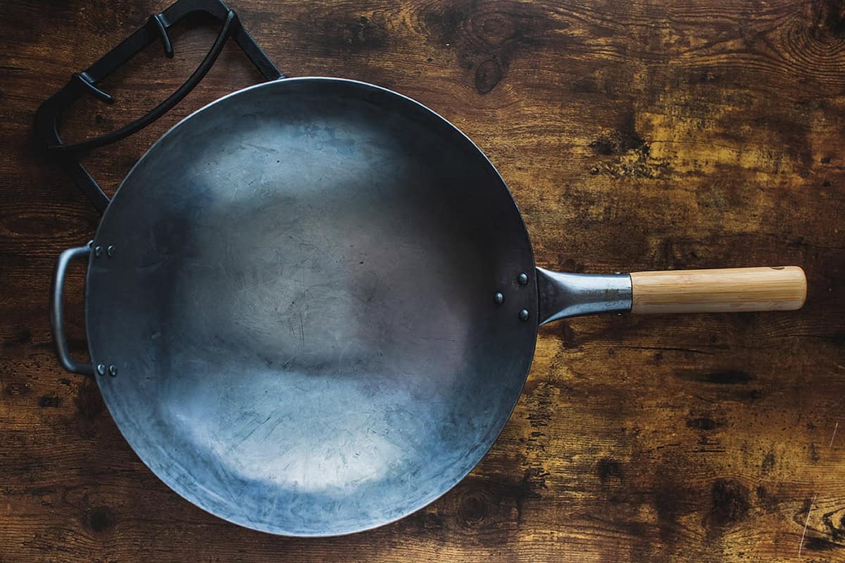 A wok on the table.