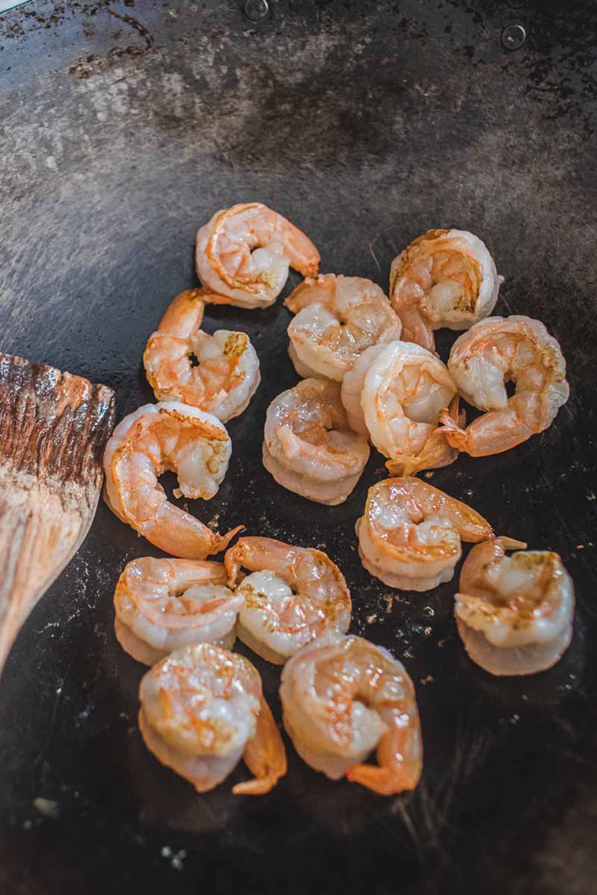 Shrimp pan fried in a wok.