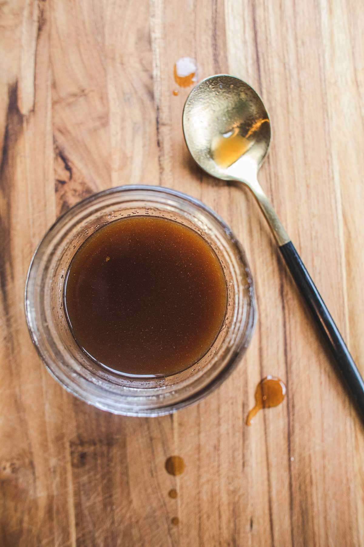 Pad thai sauce in a bowl on cutting board.