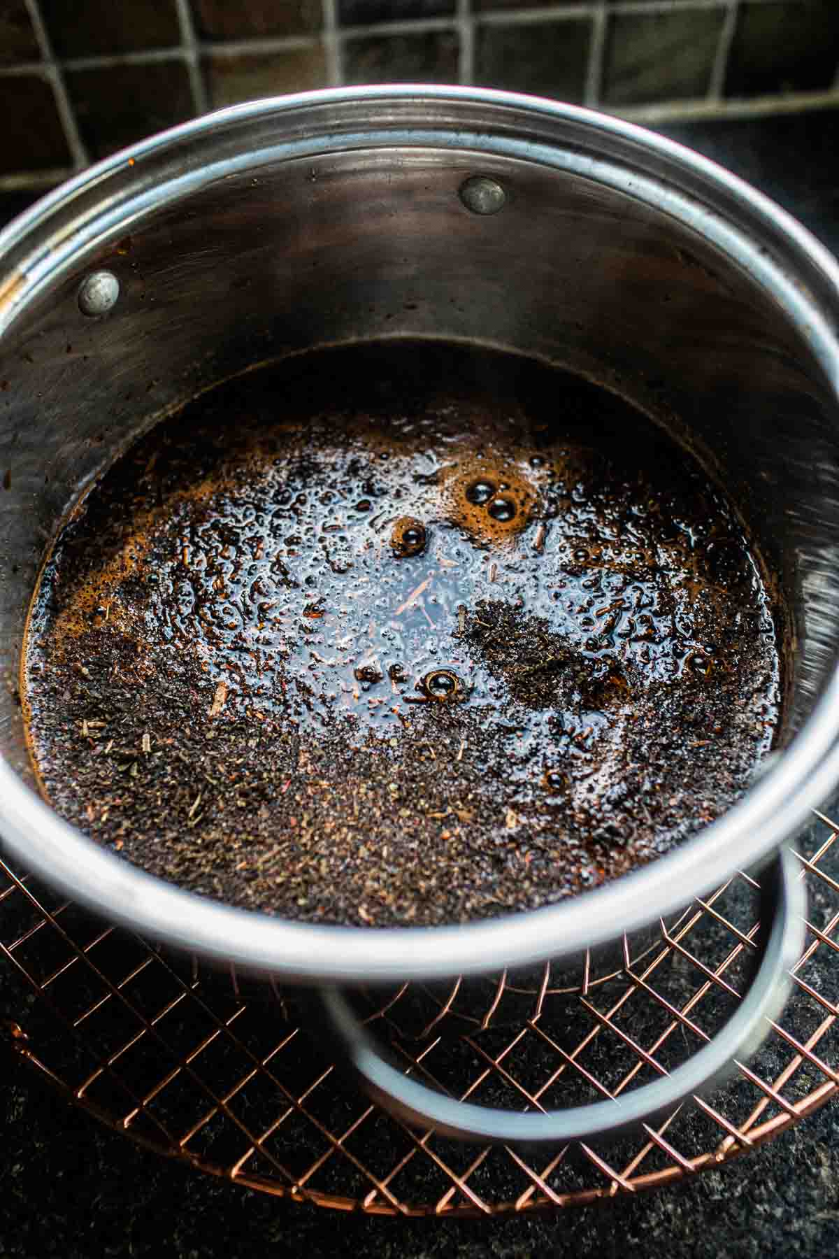 Thai tea mixture in water in a pot. 