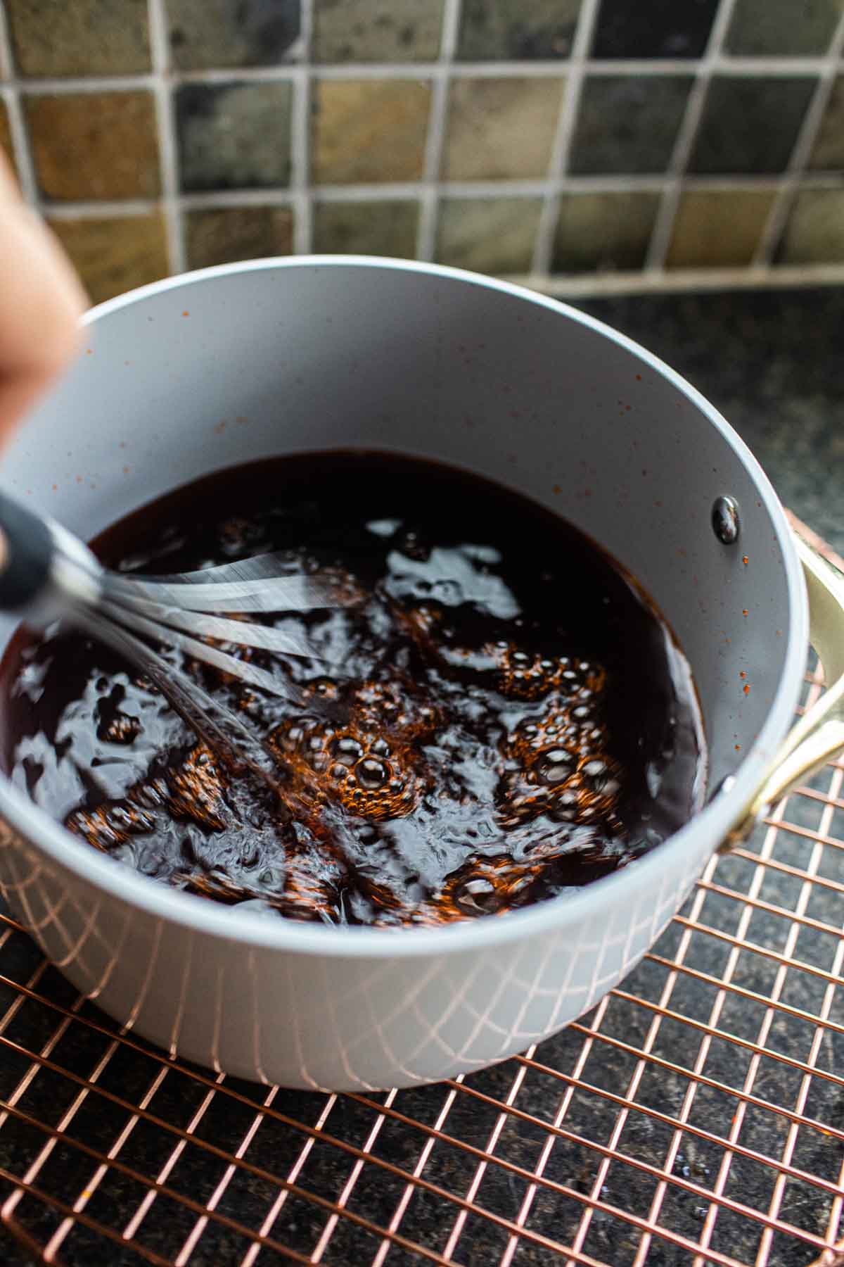 Whisking tea drink in a pot