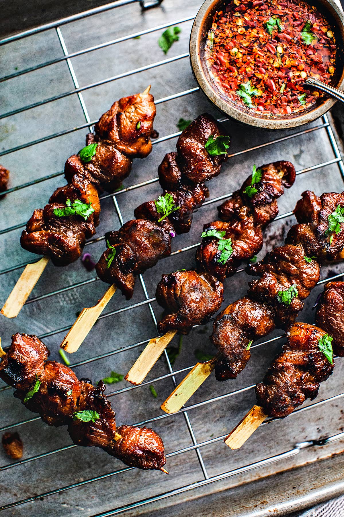 Premium Photo  Closeup of grilled skewered milk pork on stick thai street  food market