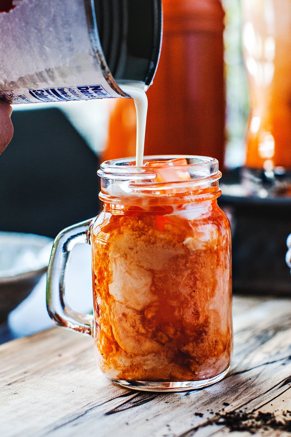 Thai iced tea in drinking glass on the table. 