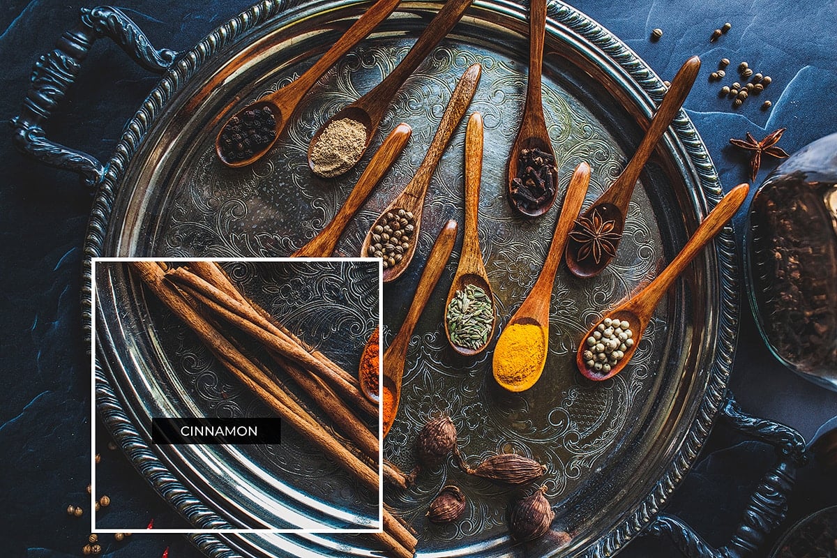 Whole cloves on a stray with other spices.