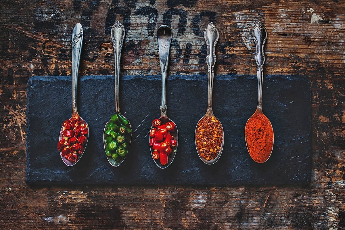 Various forms of Thai peppers on a tray.