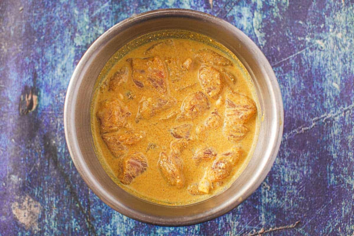 chicken satay in marinading bowl