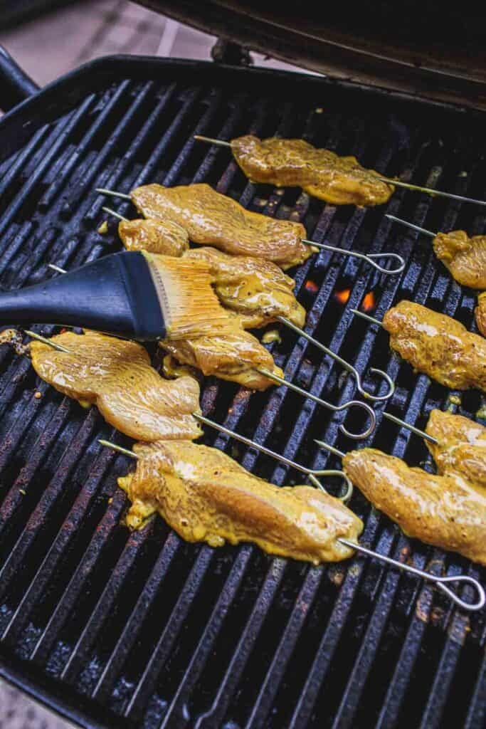 Grilled Thai chicken skewers on the grill.