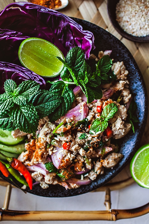 A healthy and easy Thai chicken salad recipe with fresh flavors. This low carb, gluten free and Keto friendly dish offers a fresh, lightly spicy and tangy flavor. And top it off with a slight crunchy and earthy texture from the toasted rice.