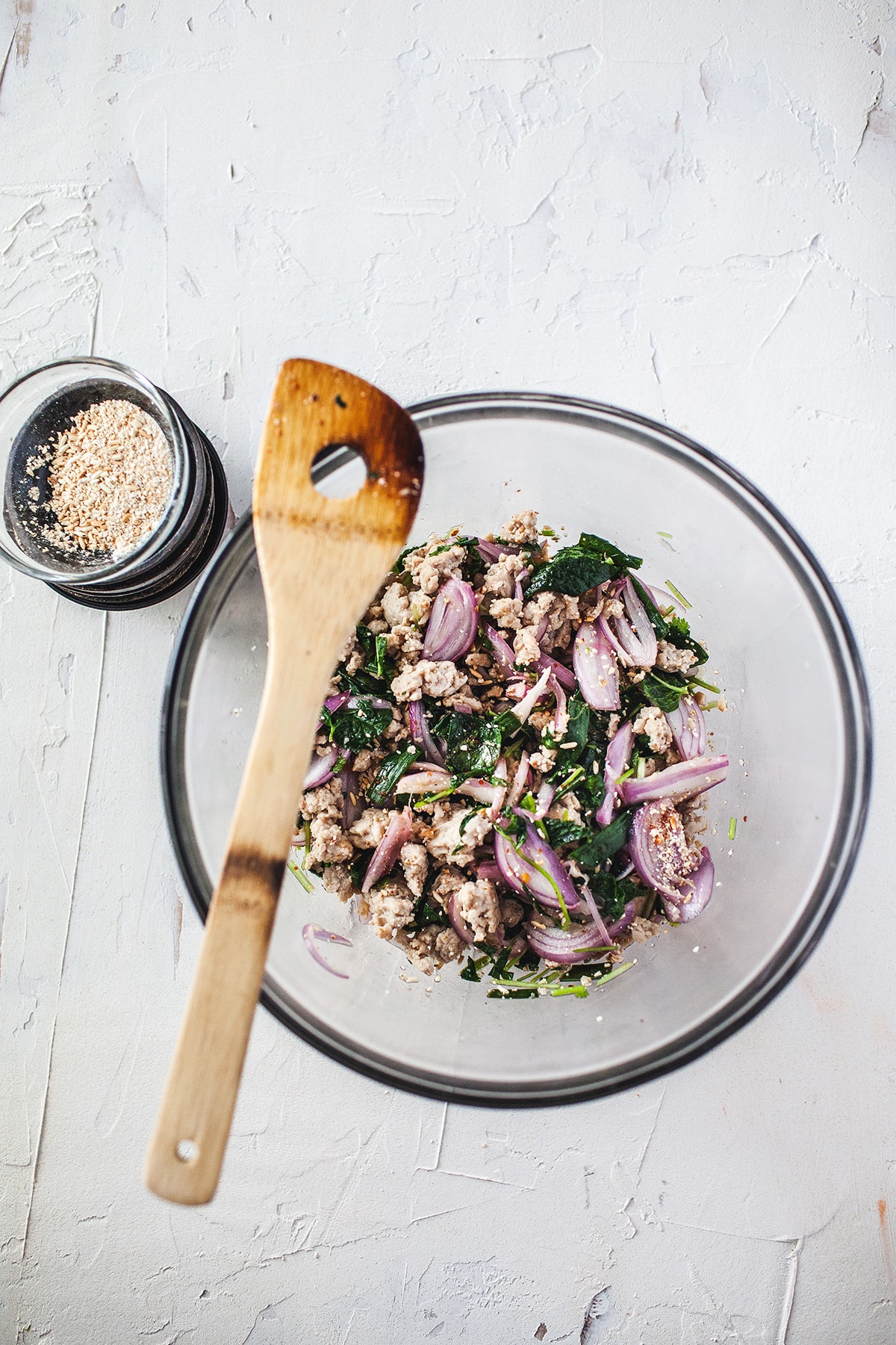 Larb gai recipe in a bowl on the table. 