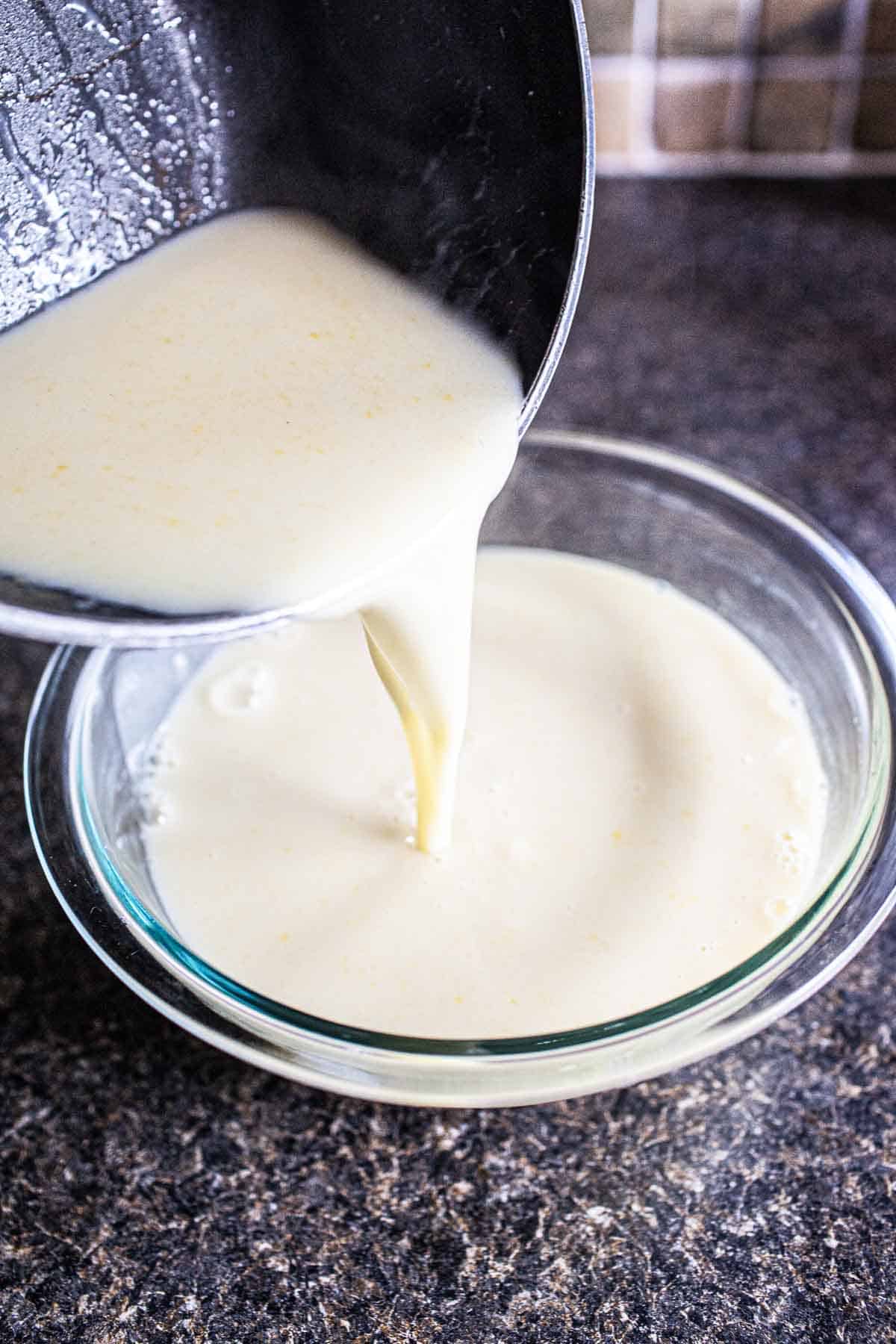 coconut cream mixture pouring into a bowl. 