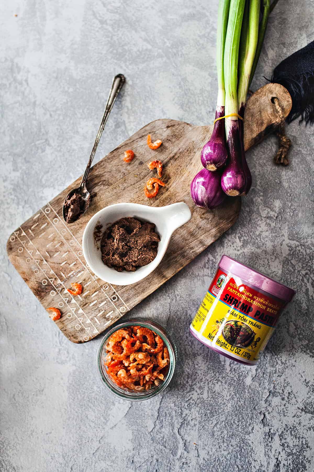 Shrimp paste on a cutting board on a table.