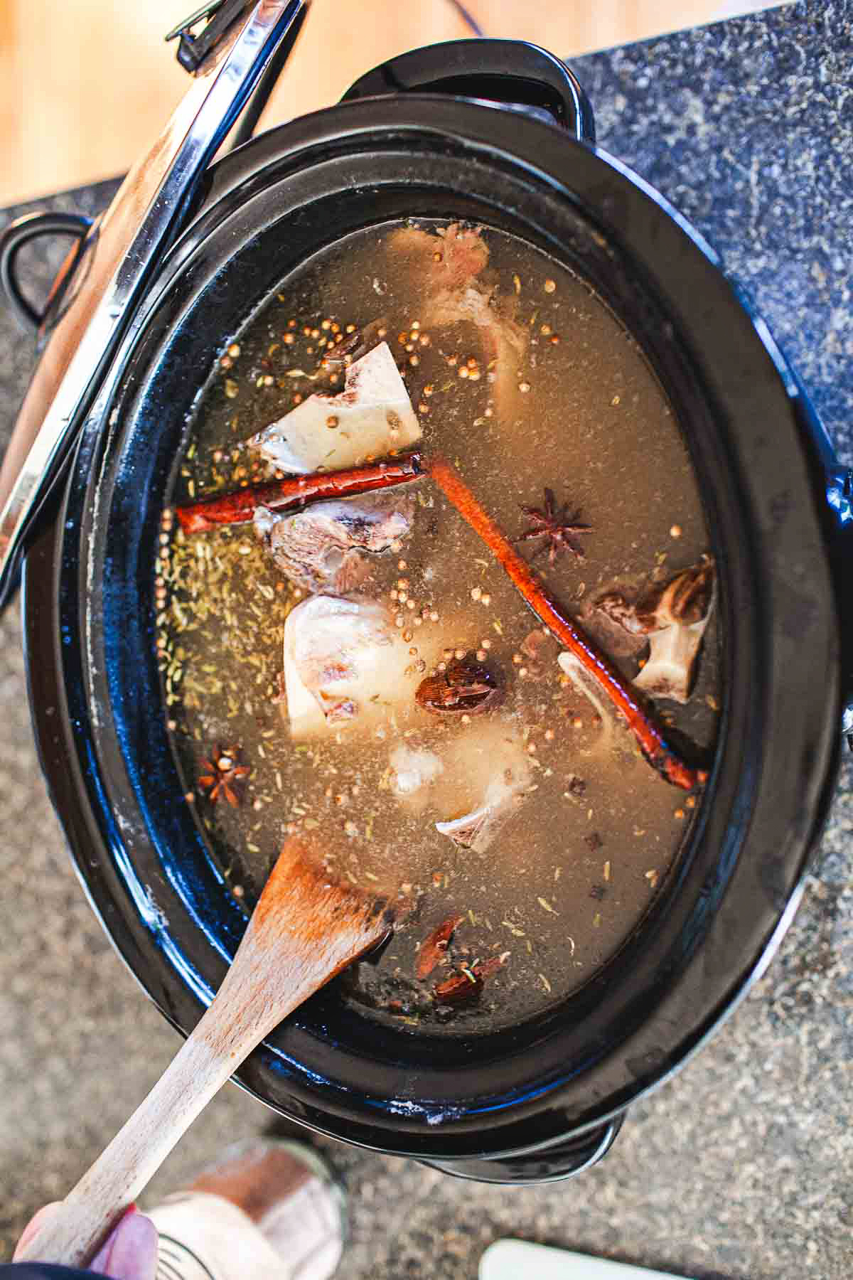bone broth and spice in a crock pot.