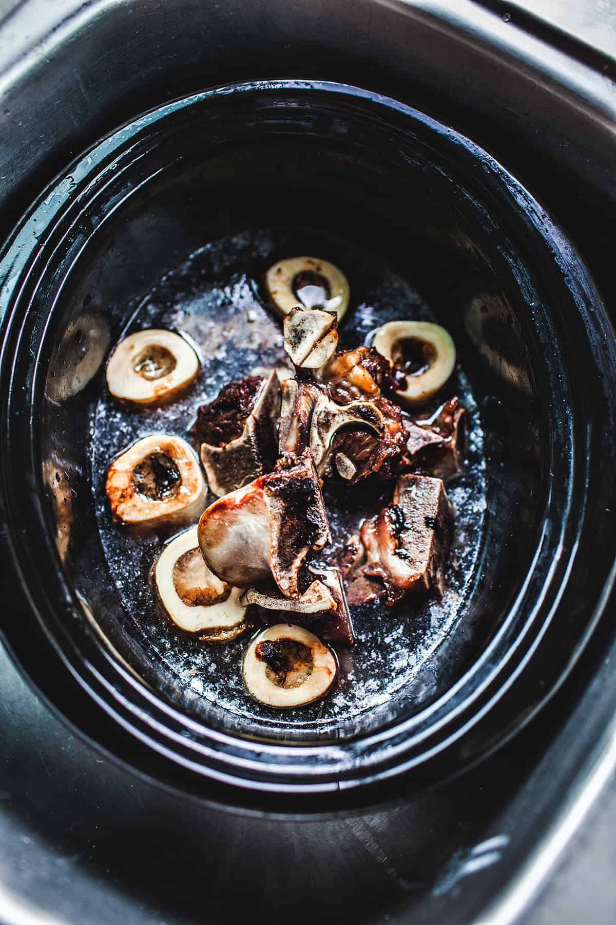 Beef bones for broth in a crock pot.