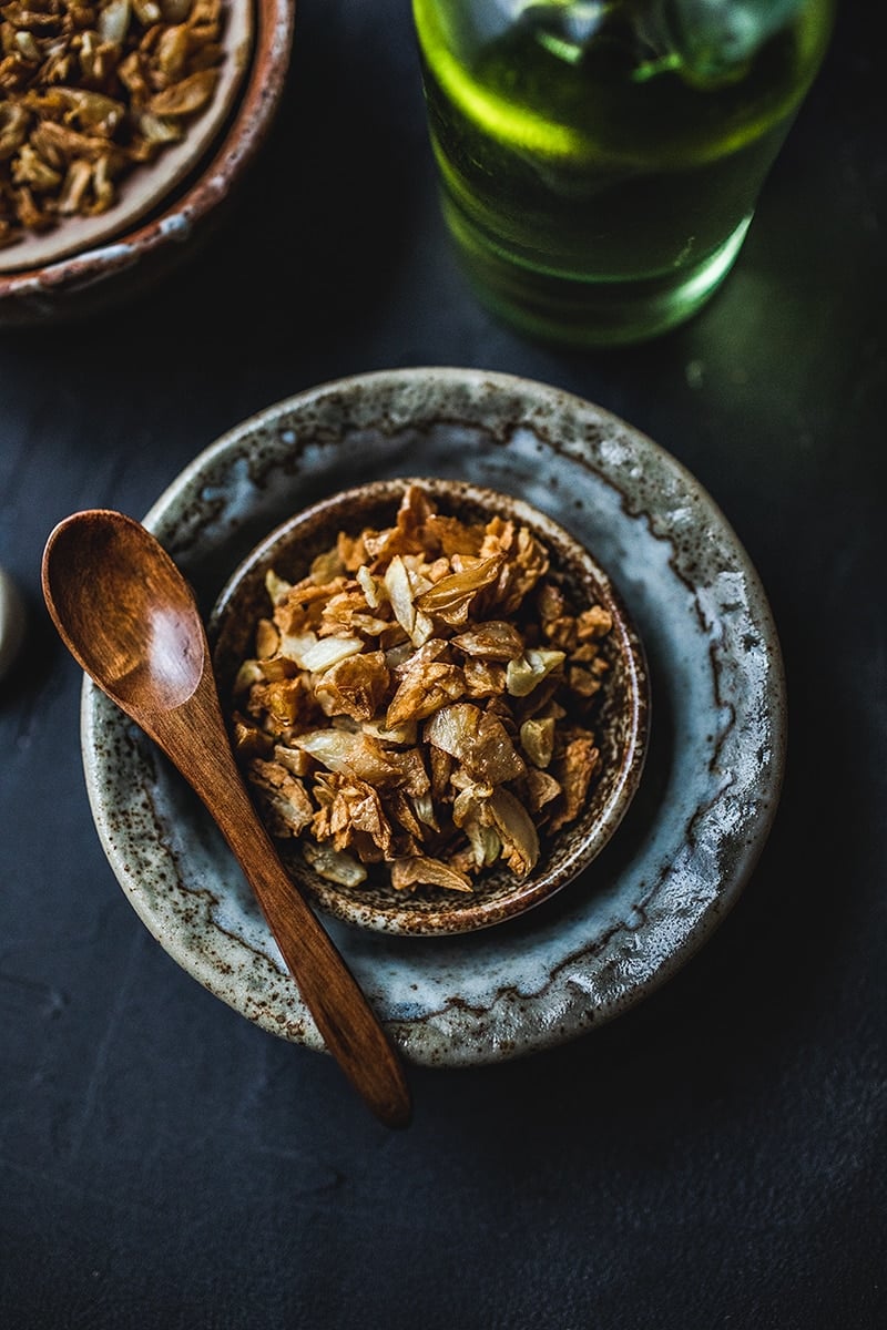 This Thai fried garlic recipe is a delicious topping used in many Thai dishes. The step by step, in photos, will show you how easy it is to make this aromatic crispy garnish! #thaifriedgarlic #crispyfriedgarlic #friedgarlicrecipe