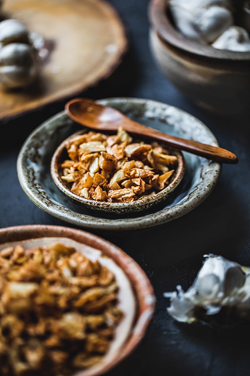 This Thai fried garlic recipe is a delicious topping used in many Thai dishes. The step by step, in photos, will show you how easy it is to make this aromatic crispy garnish! #thaifriedgarlic #crispyfriedgarlic #friedgarlicrecipe