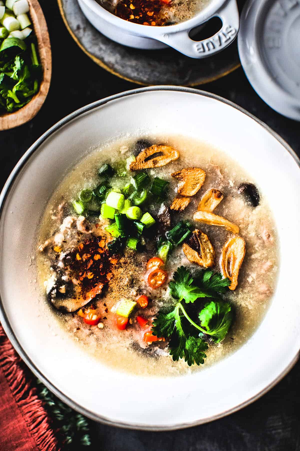 Thai rice soup Kao Tom in a bowl. 