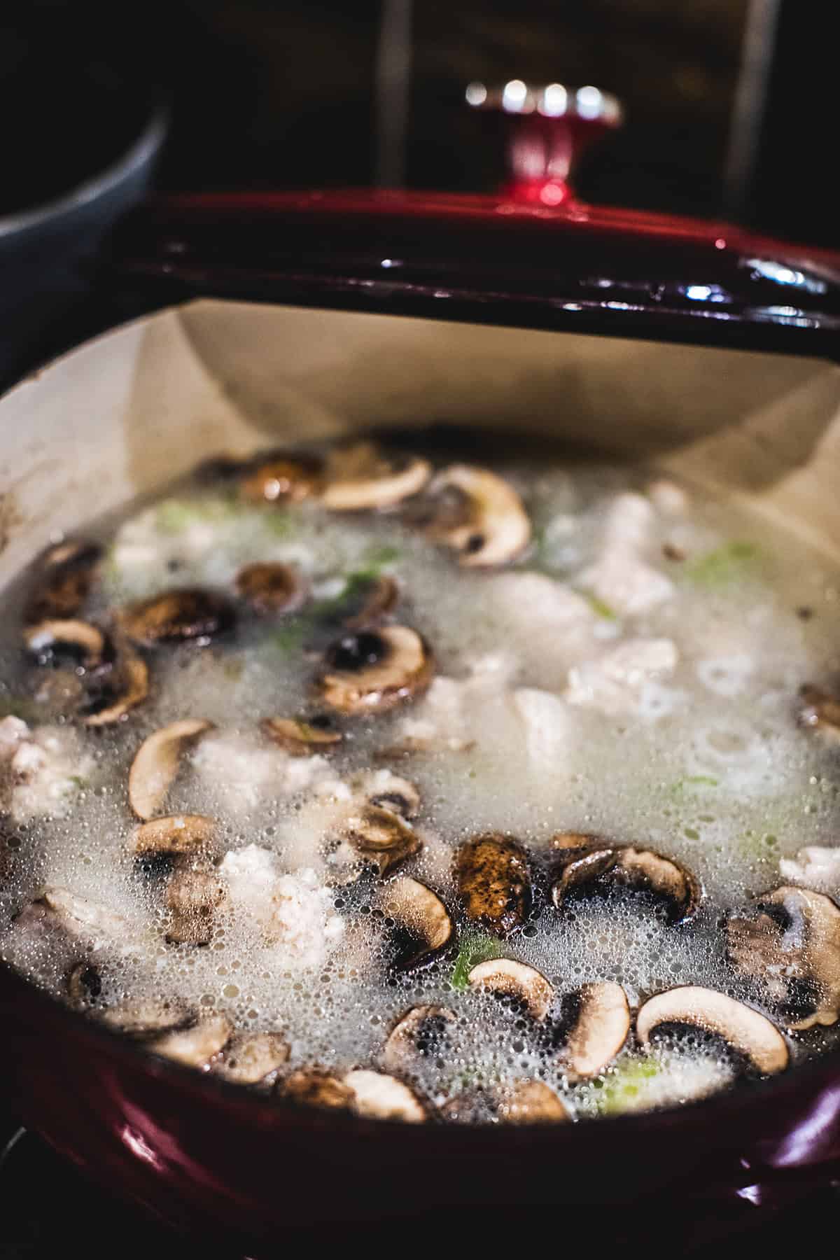 Mushrooms in Thai chicken rice soup pot. 