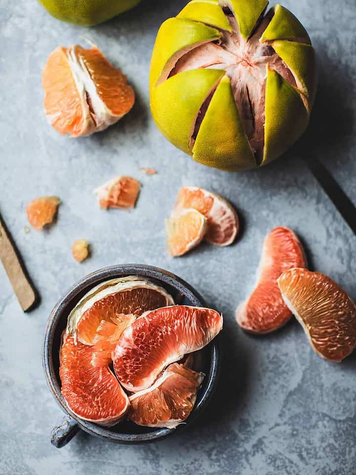 Pomelo fruits on a table.