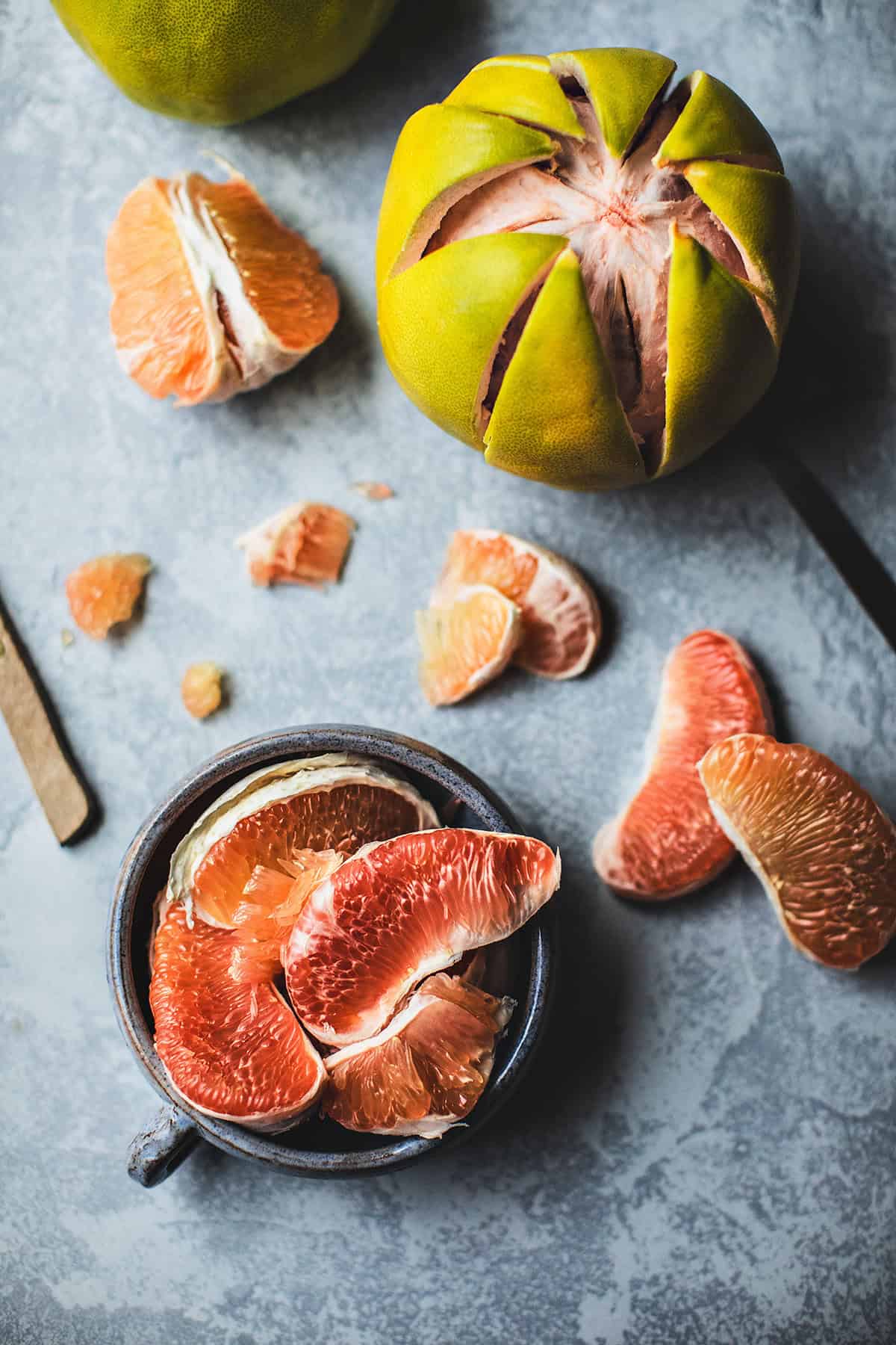 Pomelo fruits on a table.