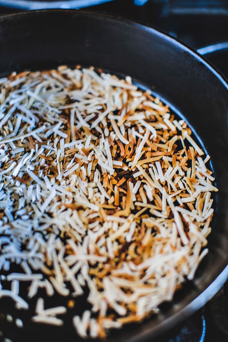 Toasted coconut flakes in a pan
