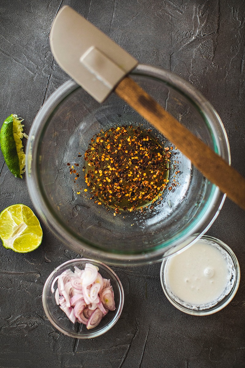 Thai pomelo salad dressing in a glass bowl