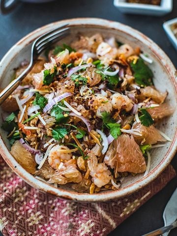 thai pomelo salad with shrimp on a platter