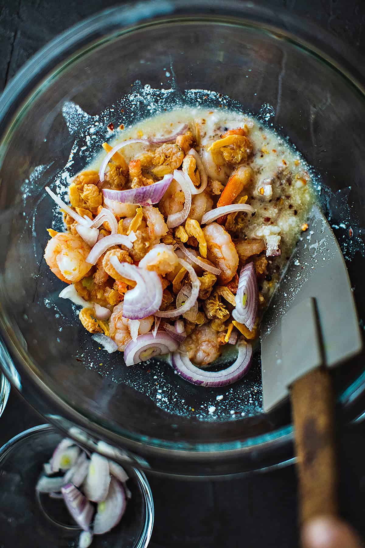 Shrimp and shallots in a Pomelo salad sauce in a bowl. 