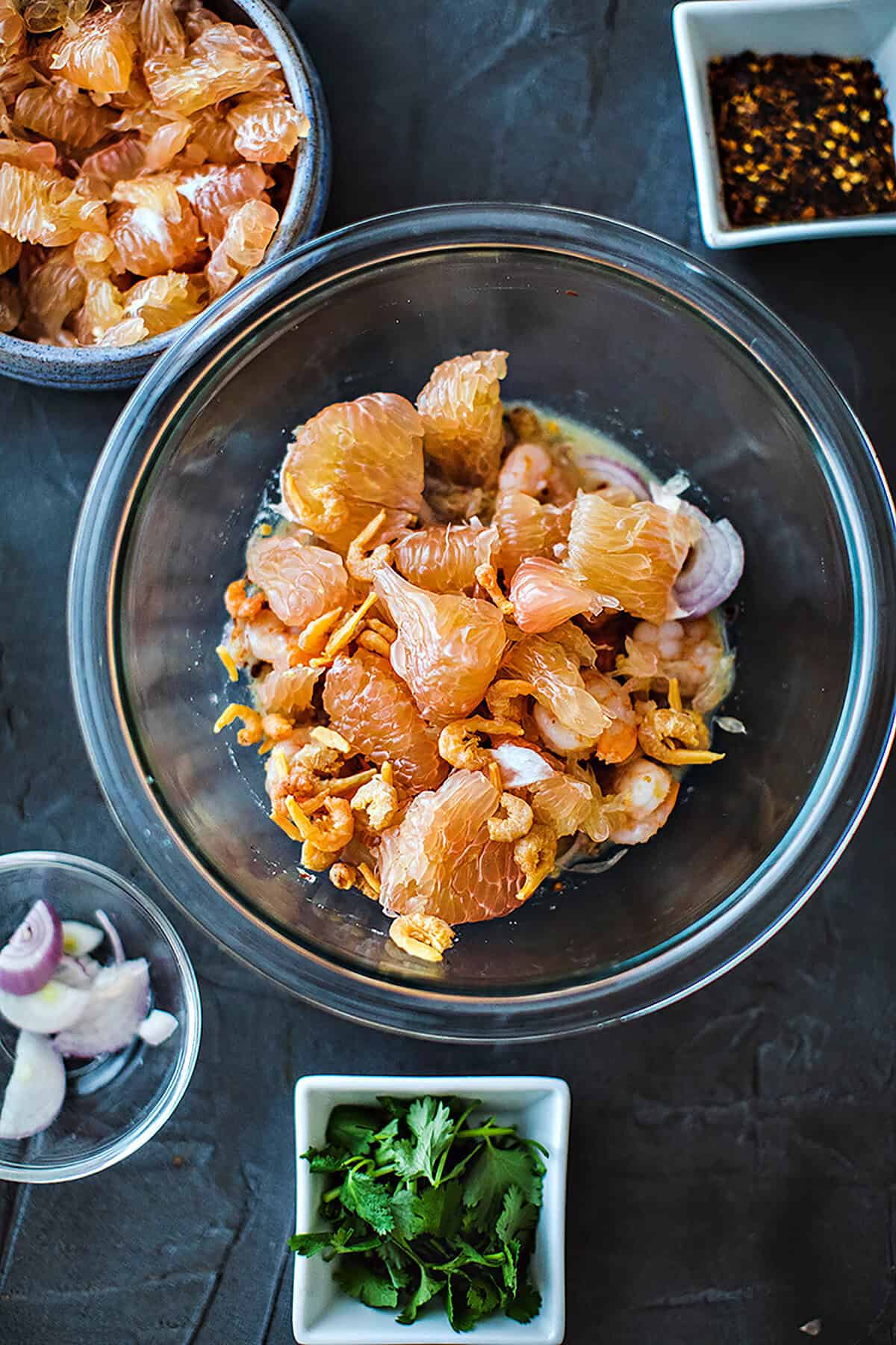 Pomelo pieces in a Pomelo salad sauce in a bowl. 