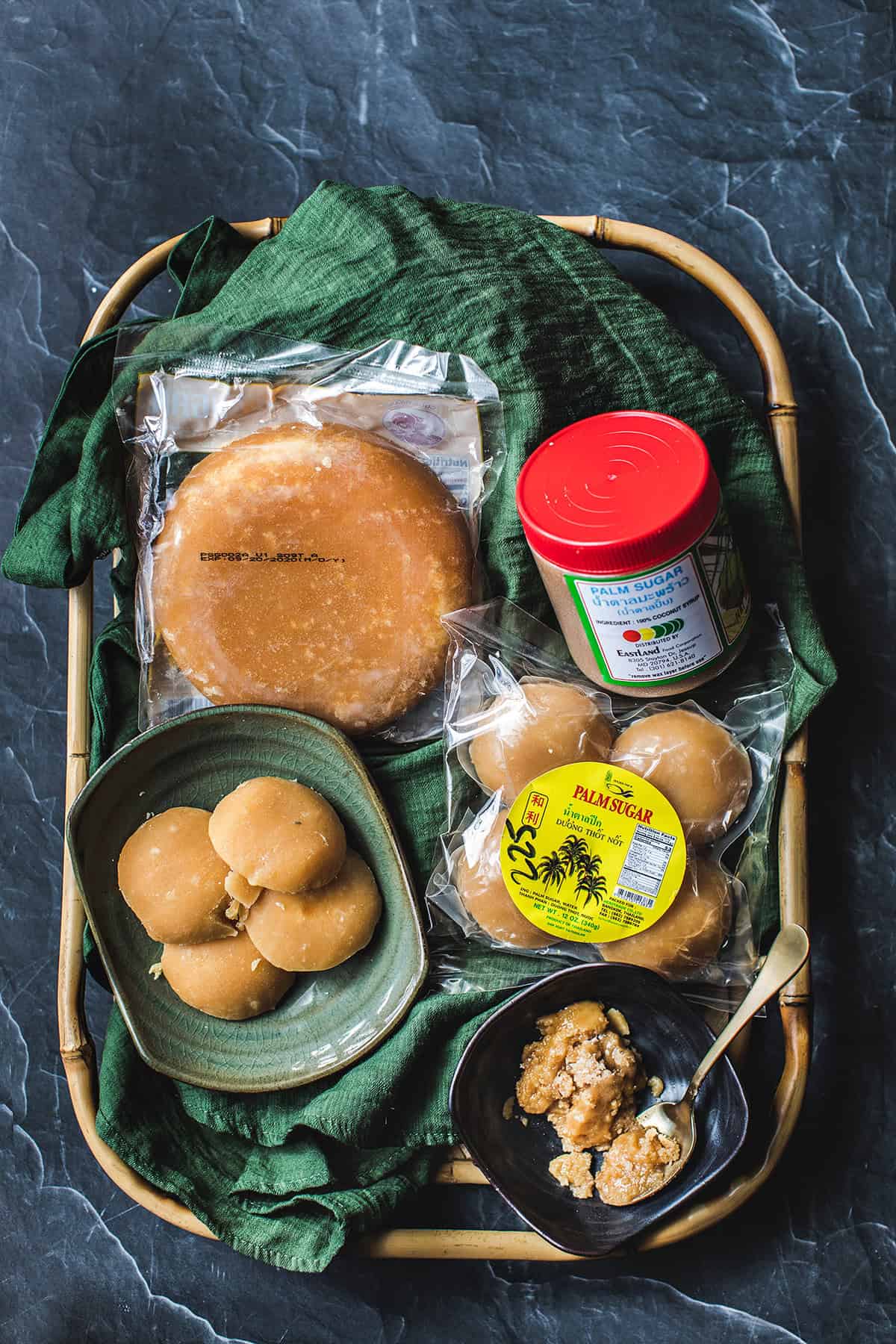 Different types of palm sugar on a tray. 