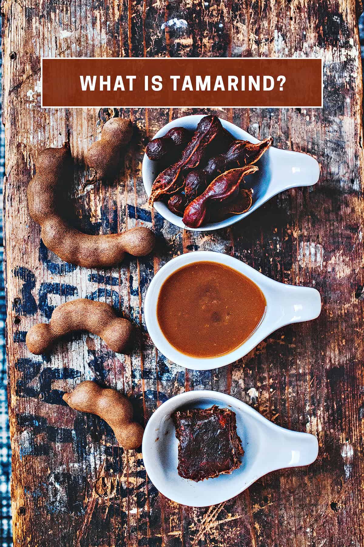 tamarind paste, juice and pods in white bowls.