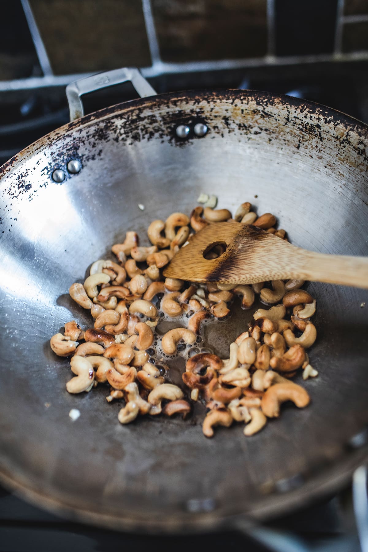 Cashew nuts frying in a wok