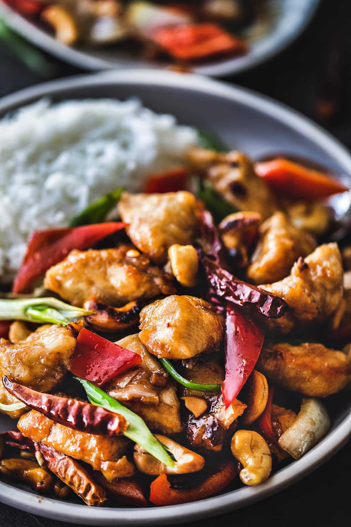 Thai cashew chicken in a bowl with rice. 