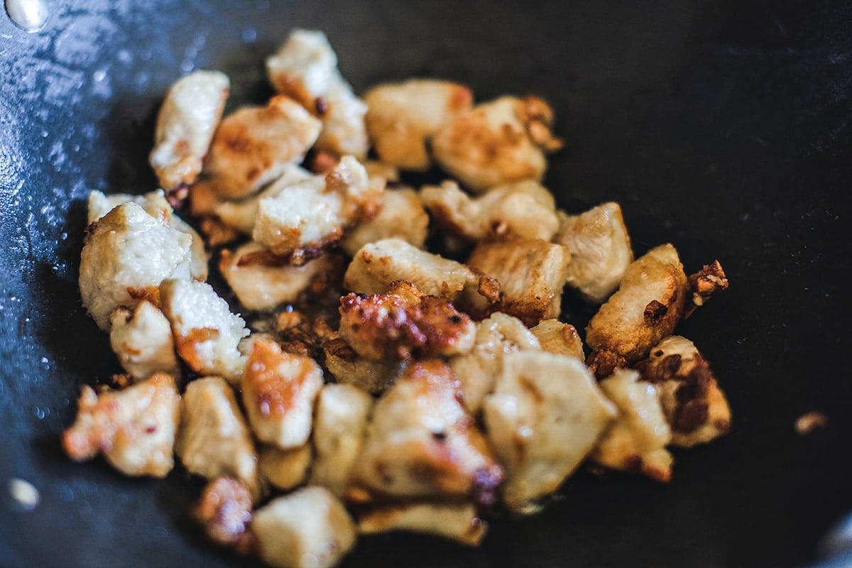 chicken for cashew chicken in a wok.