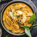 red curry in a black bowl