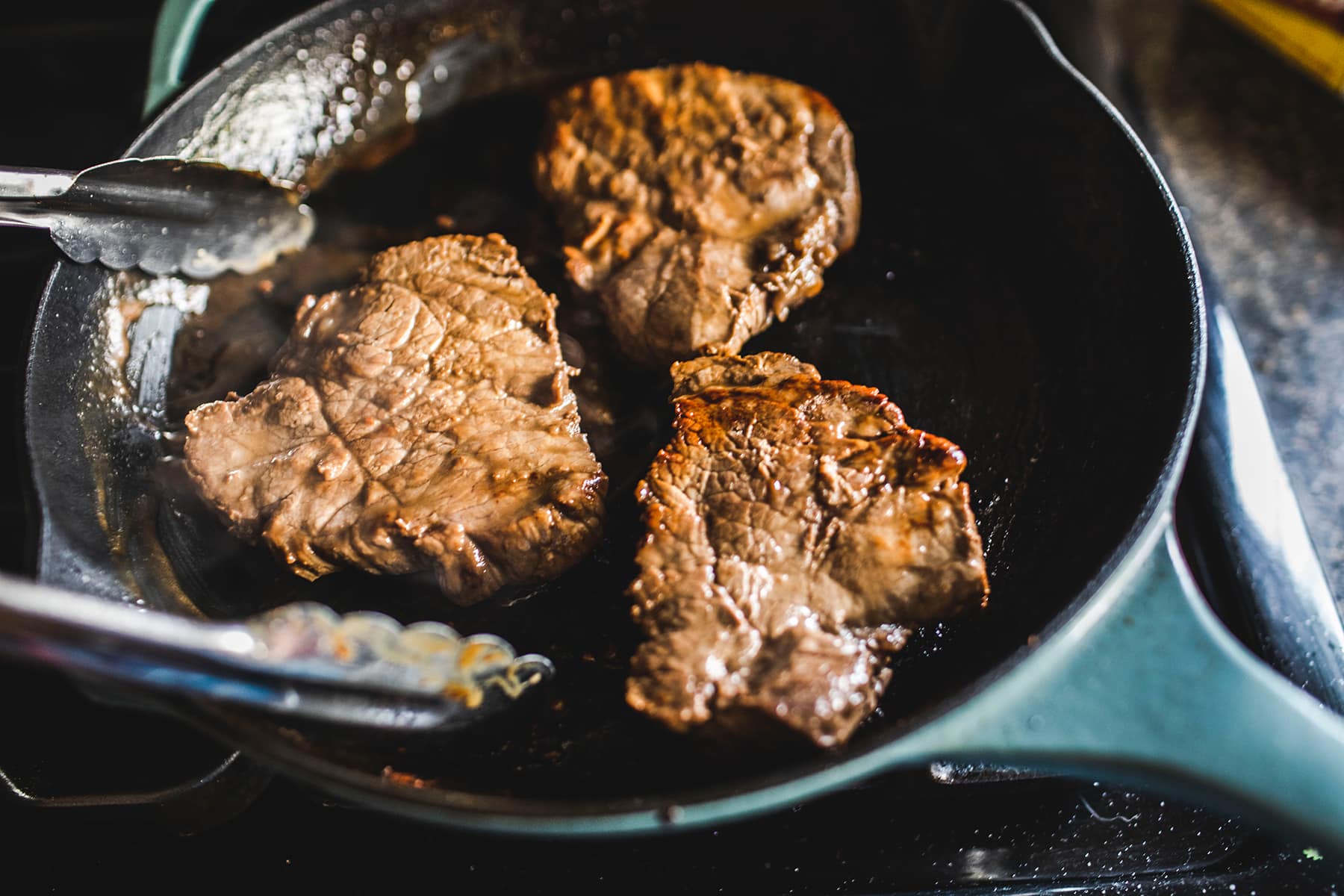 Steak for Thai beef salad in a pan.