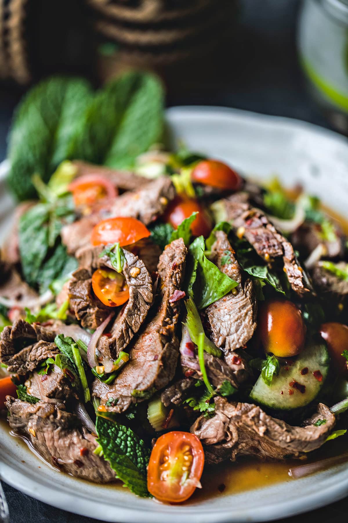Thai beef salad on a plate.