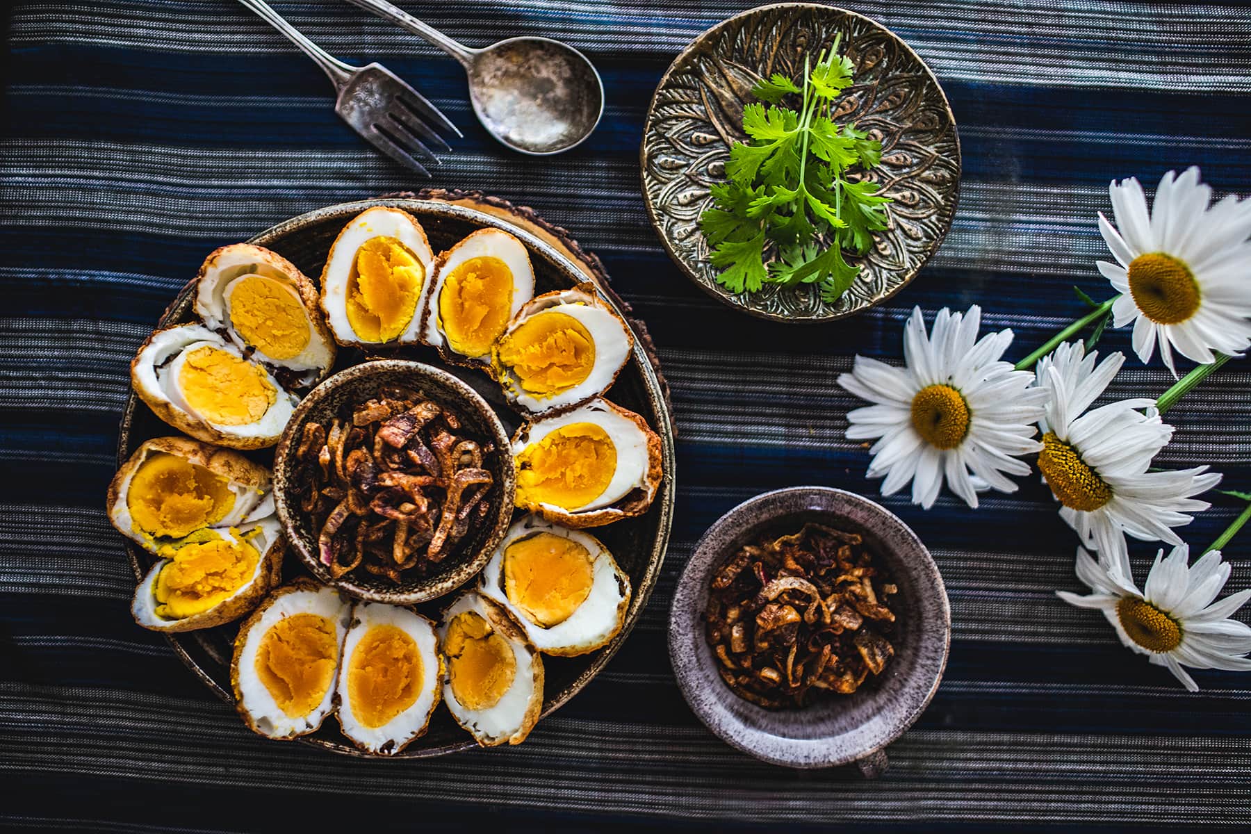 how to make son in law eggs on the table with garnishes around. 