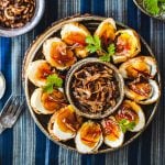 Thai Son-in-Law Eggs on a platter with crispy shallots