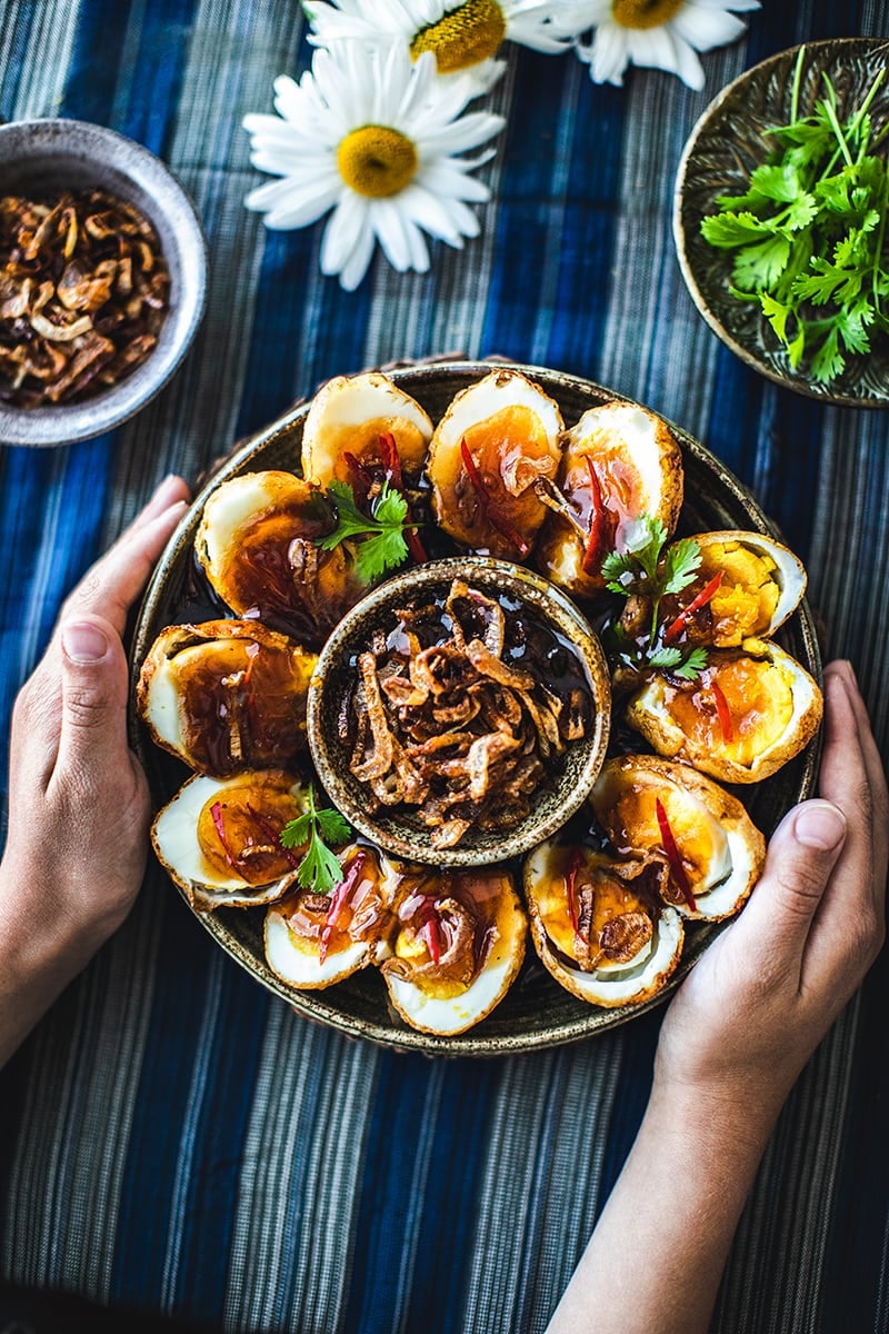 Son in law eggs recipe Thai Son-in-Law Eggs is a simple recipe that uses hard-boiled eggs, deep-fried until the skin is golden brown, then served with a perfectly balanced dressing made from tamarind juice, fish sauce, and palm sugar. #soninlaweggs #easythairecipe #padthaisauce