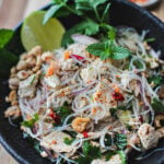 glass noodle salad with chicken in a bowl.