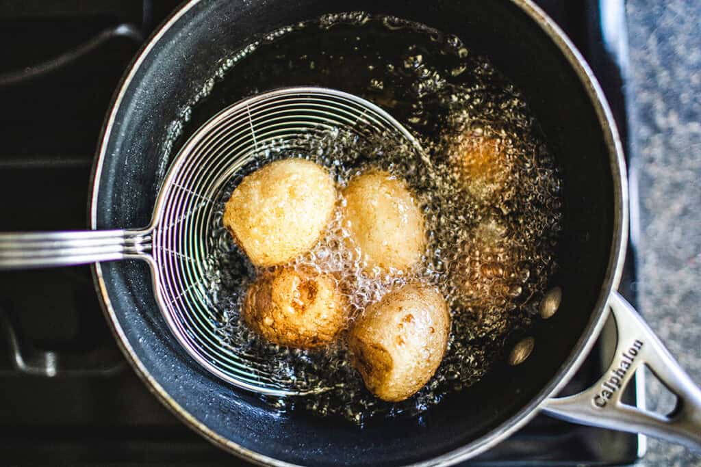 Frying eggs for son in law eggs.