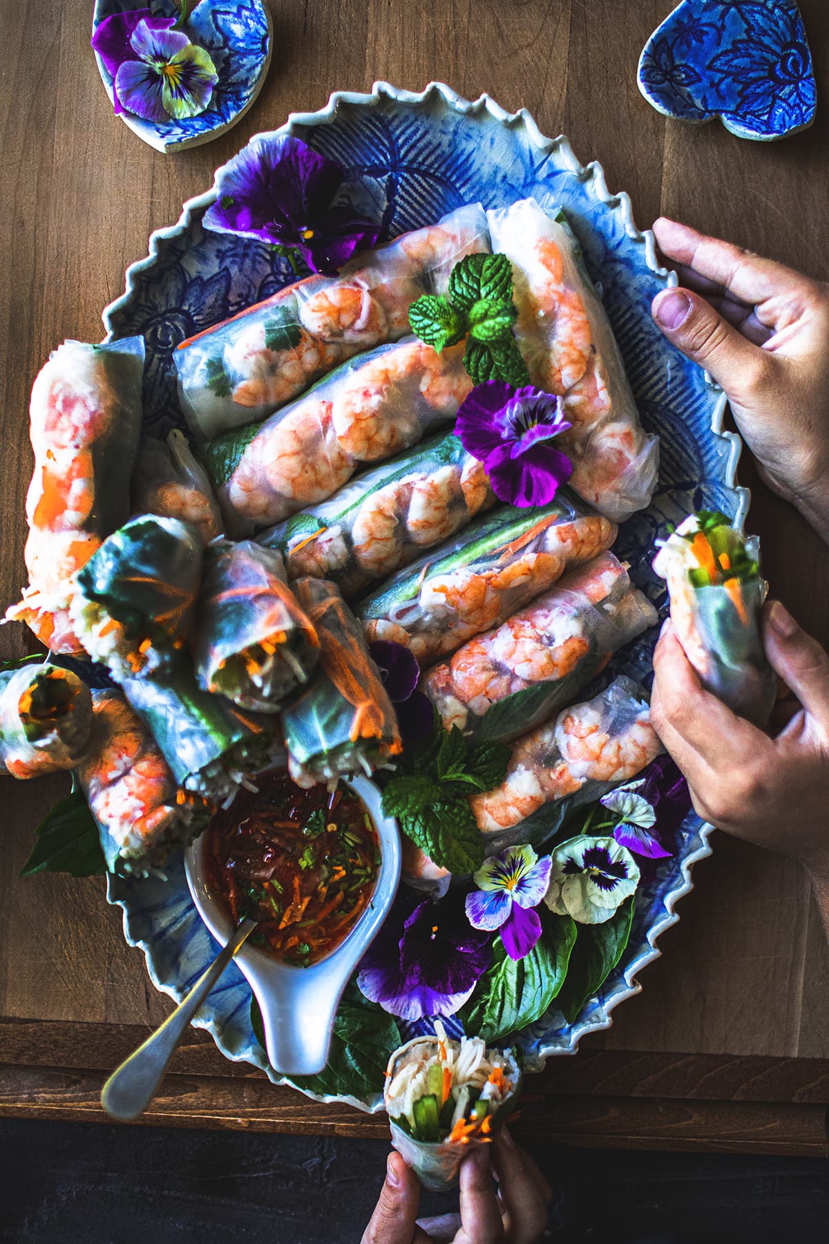 Vietnamese fresh shrimp spring rolls on a blue platter.