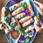 Vietnamese spring rolls on a blue platter.