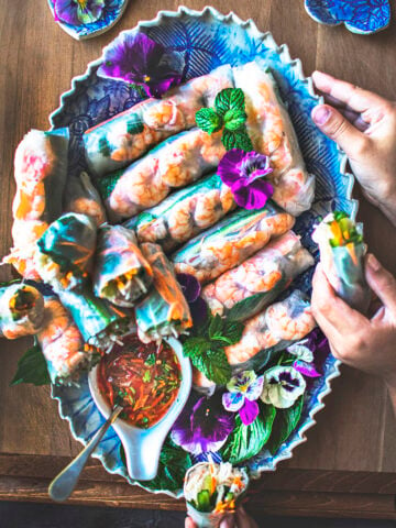 Vietnamese spring rolls on a blue platter.