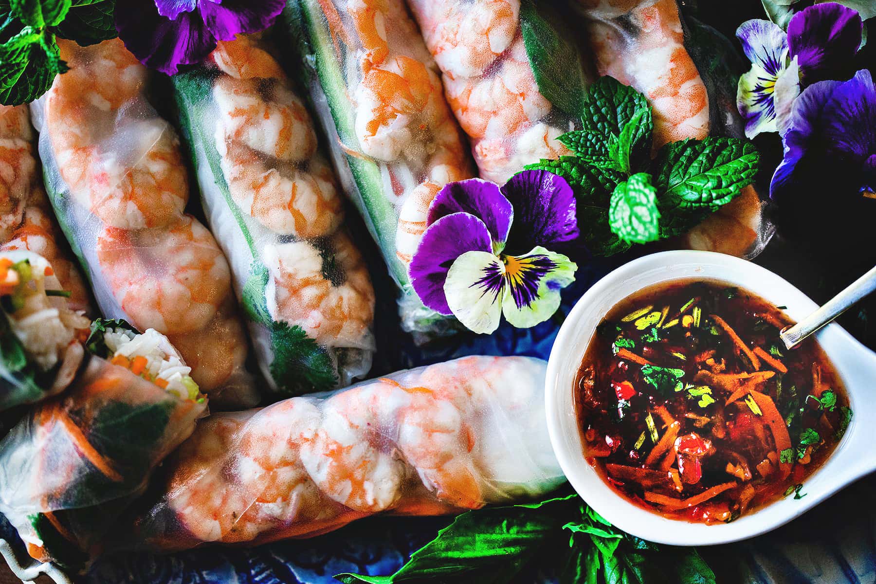 Shrimp spring rolls with chili dipping sauce.