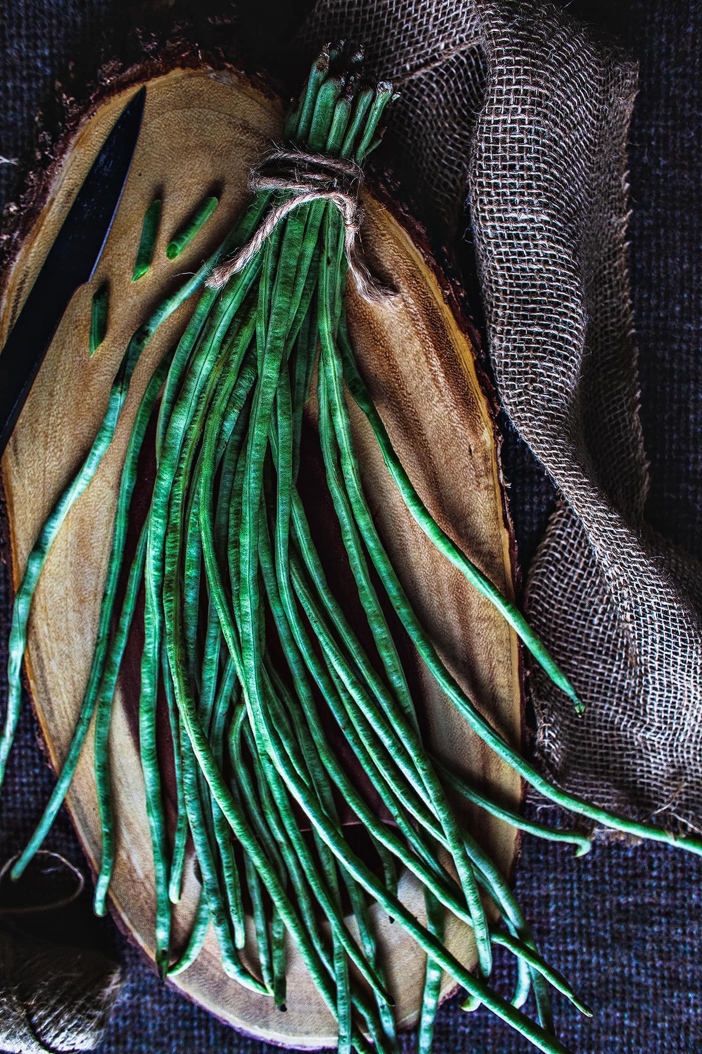 Thai long green beans on a cutting board