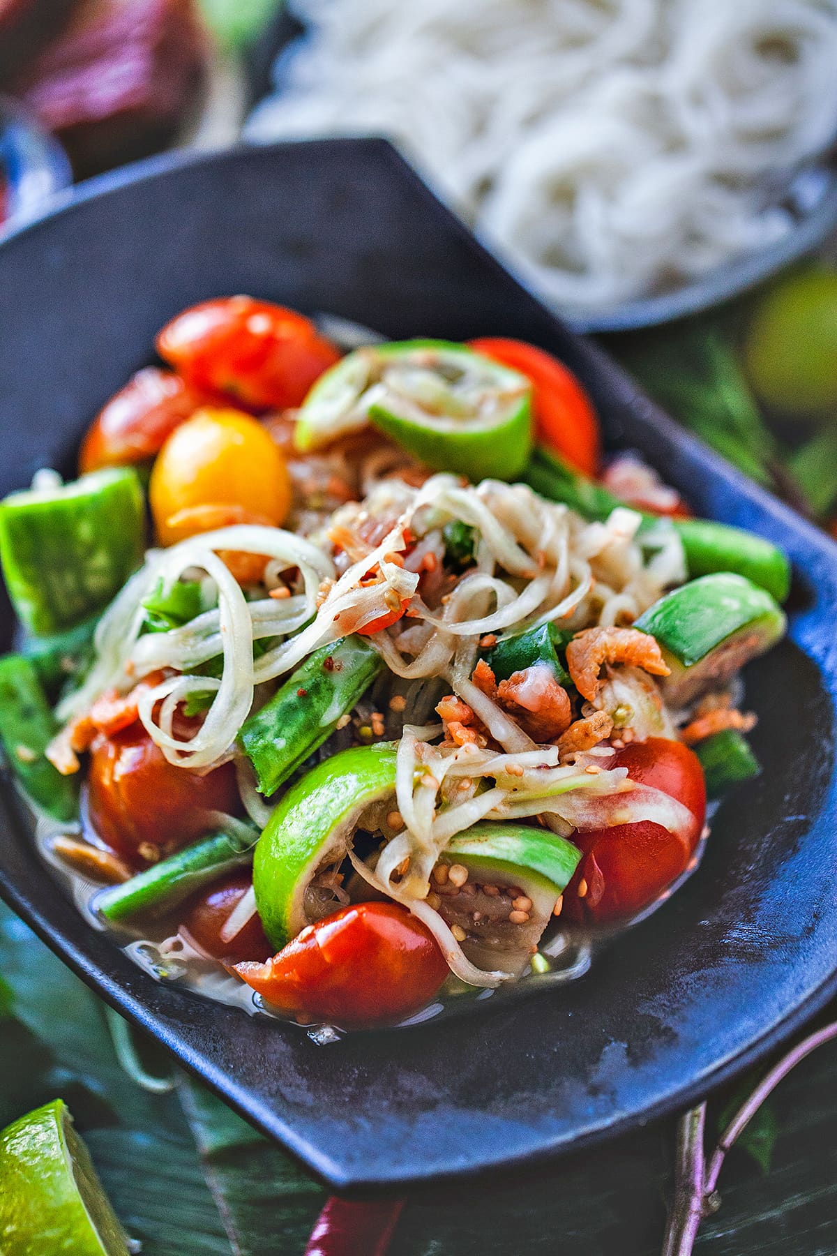 Thai papaya salad in a small bowl.