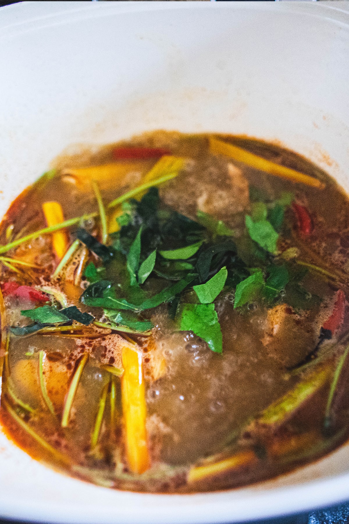 tom yum broth with herbs for making stock