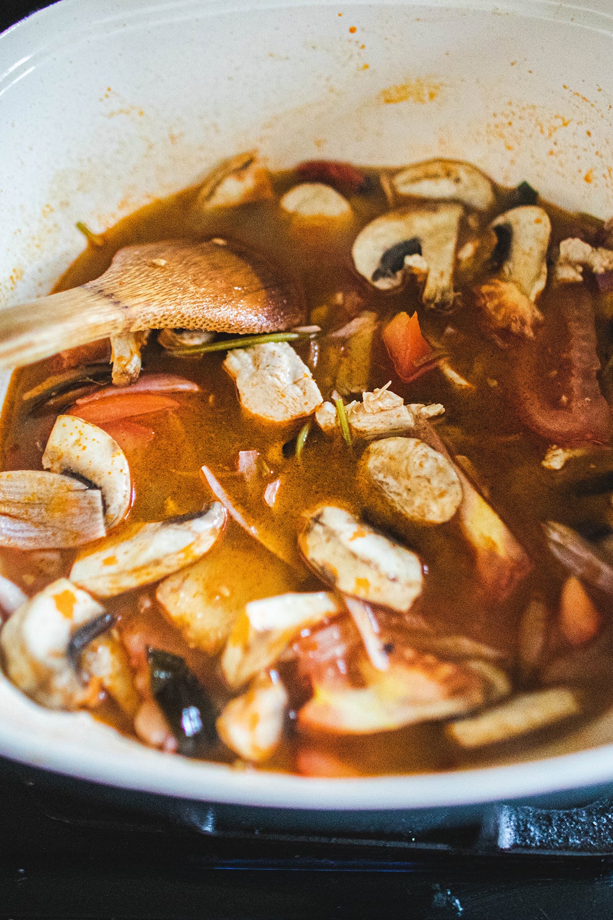 Tom yom soup in a pot on the stove 